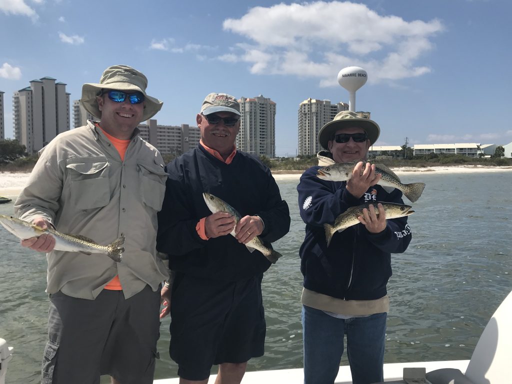 Fishing Charters Near Gulf Breeze Florida. Catching Speckled Trout in Santa Rosa Sound. 