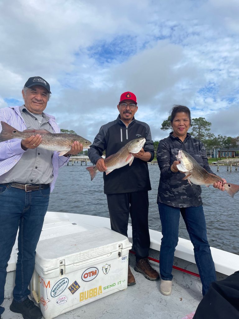 Showintail Inshore Charters skiff fishing in the shallow flats off Fort Walton Beach