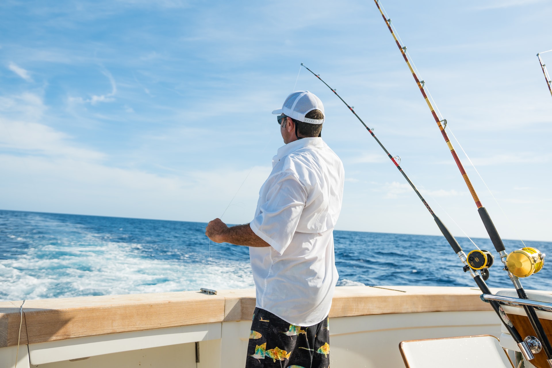 man fishing on a boat