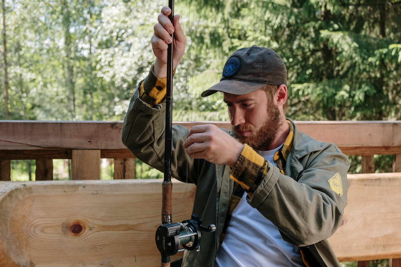 man holding fishing rod