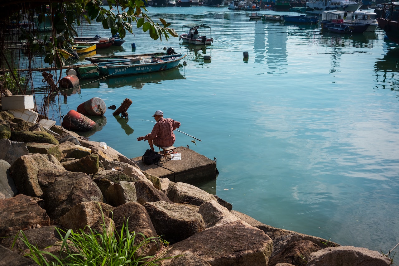 person preparing to fish in the sea