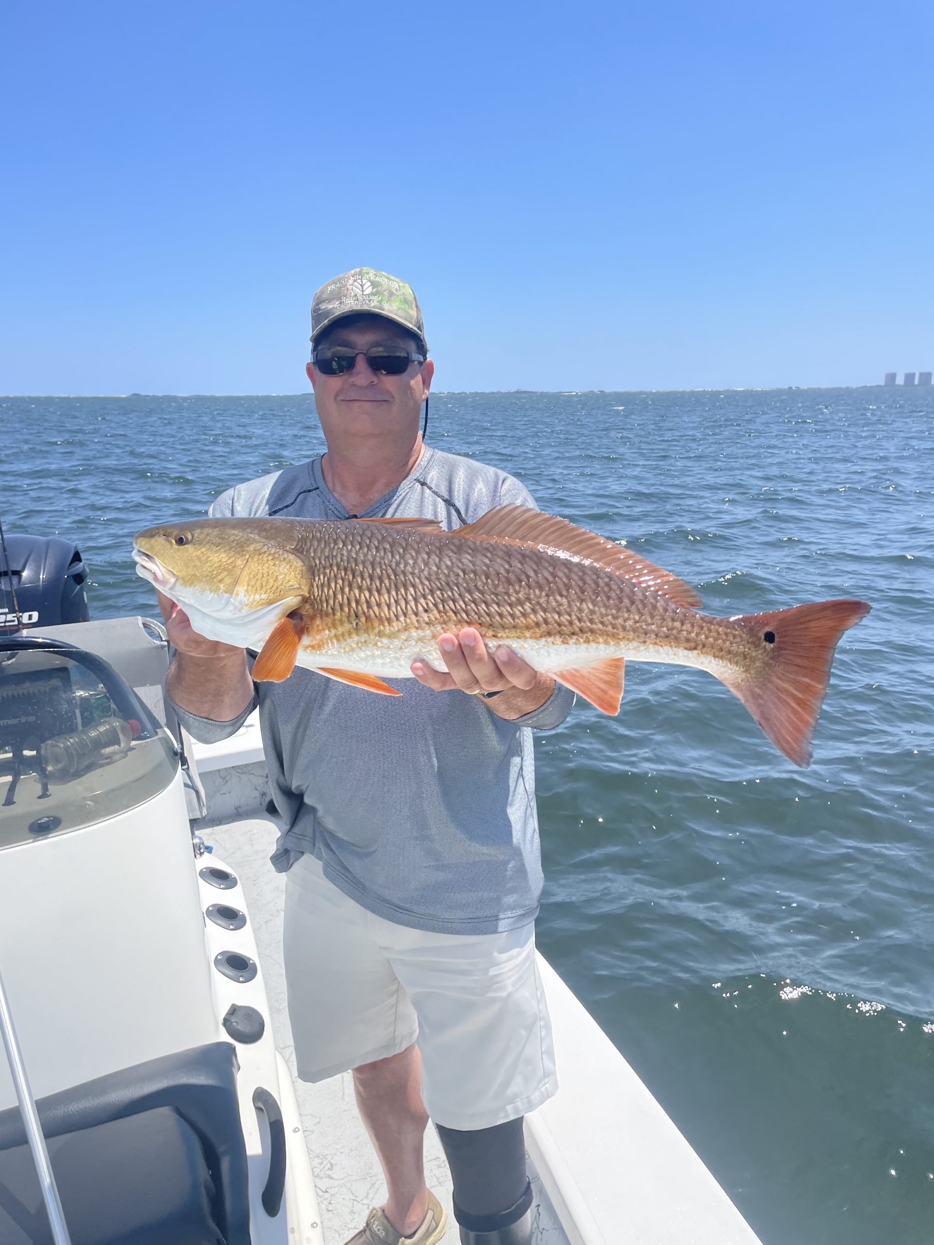 Man Holding Redfish in Santa Rosa Sound