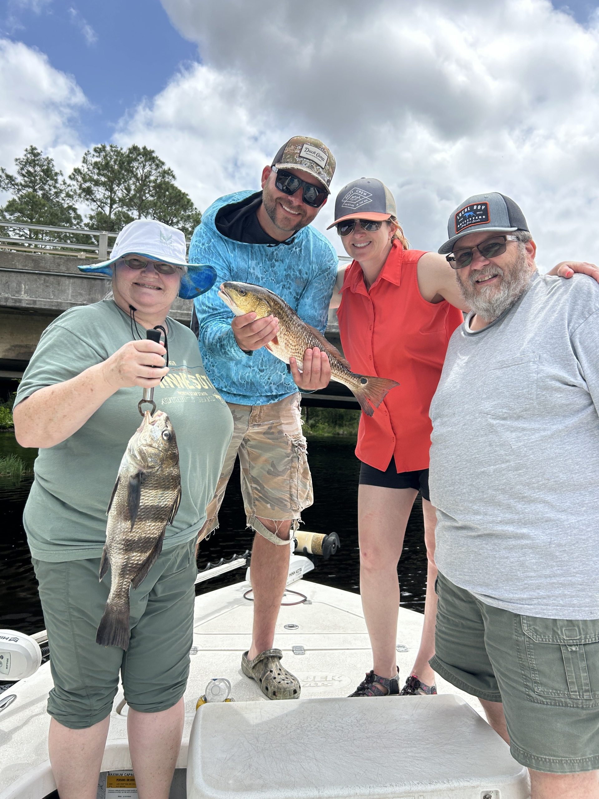 Angler holding a slot-sized redfish caught near Navarre Beach Causeway, Florida