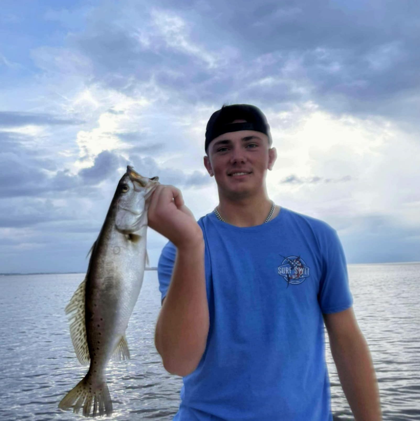 Angler with speckled trout on an inshore fishing charter near Oriole Beach, Florida with Showintail Inshore Charters