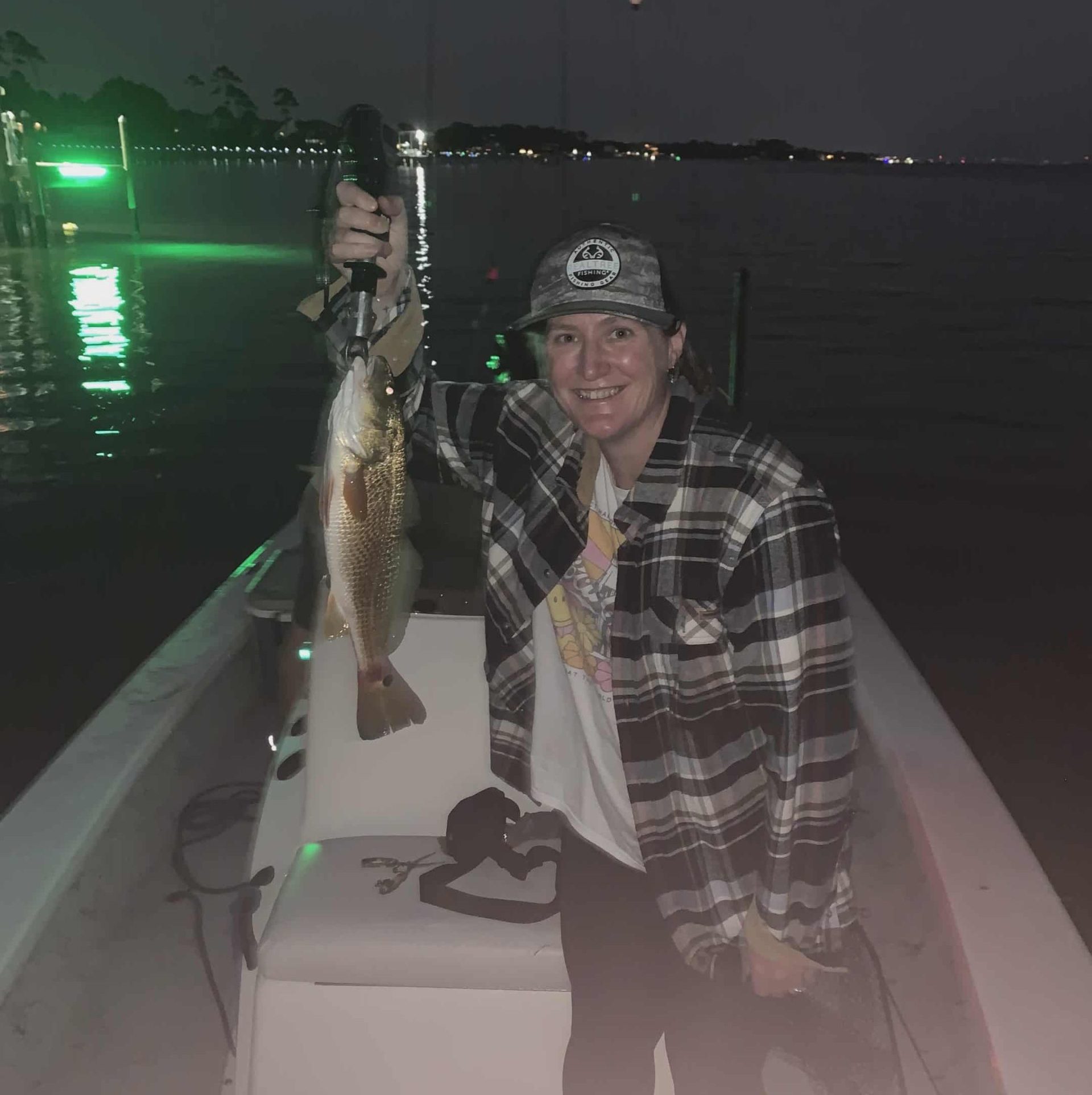 Night fishing charter in Navarre Beach targeting redfish and trout after dark