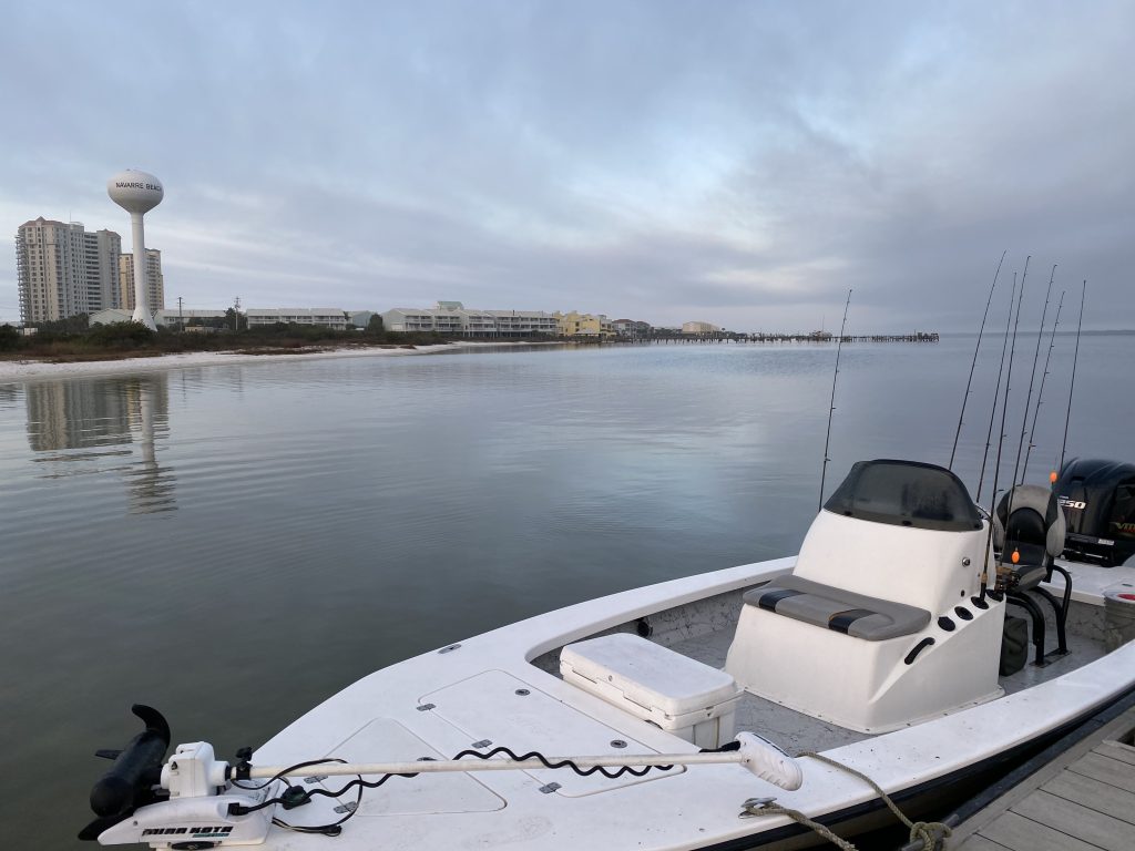 Showintail Inshore Charters boat cruising the calm waters of the Santa Rosa Sound near Navarre Beach.